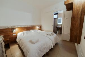 Postel nebo postele na pokoji v ubytování Hotel Alla Sosta