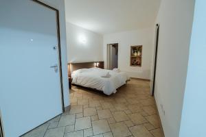 Postel nebo postele na pokoji v ubytování Hotel Alla Sosta