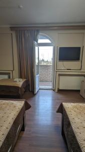 TV a/nebo společenská místnost v ubytování Dkd-bridge Hotel