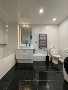 a bathroom with a sink and a toilet at PRADO PLAGE DAVID - MARINA OLYMPIQUE JO 2024 - STADE VELODROME - PARC BORELY - LA CORNICHE- CLUB NAUTIQUE - appartement situé à 800m de JO 2024 et à 10m de plage -Luxury apartment by the Sea in Marseille