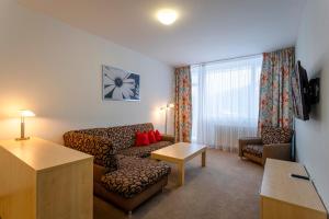 TV a/nebo společenská místnost v ubytování Hotel Běhounek