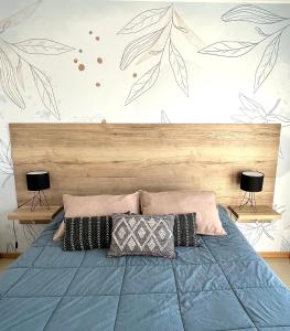 Una cama o camas en una habitación de Patagonia Suites - Departamentos