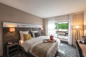 Postel nebo postele na pokoji v ubytování Mercure Annecy Sud