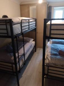a room with two bunk beds and a window at Connolly Private Guest House in Dublin
