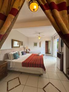 a bedroom with a large bed in a room at Aquabarra Boutique Hotel & Spa in Búzios