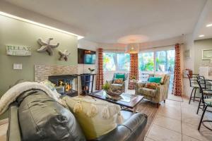 a living room with a couch and a fireplace at Beach Haven 1 in San Diego