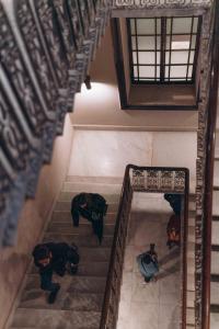an overhead view of two people walking down stairs at Mazeej Balad in Cairo