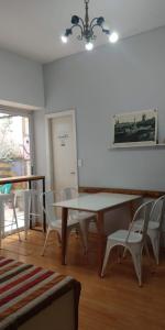 a dining room with a table and chairs at LUCO HOTEL in Buenos Aires