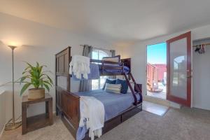a bedroom with a bunk bed and a balcony at Beach Haven 2 in San Diego
