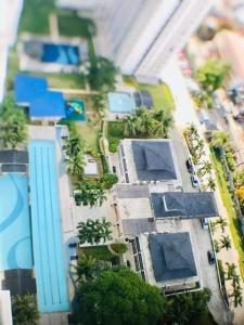 a model of a city with palm trees and buildings at The Grass Residences in Manila