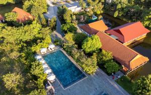 an overhead view of a swimming pool in a resort at Memorina Ninh Binh Resort in Ninh Binh