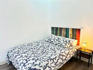 A bed or beds in a room at Madrid Rio Antonio Lopez A