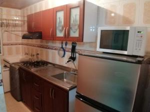 A kitchen or kitchenette at Apartamento a 20 minutos del aeropuerto