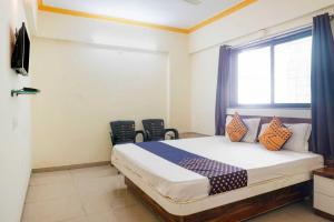 Lova arba lovos apgyvendinimo įstaigoje SPOT ON Hotel Gaurav Lodge