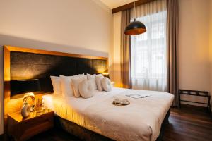 Postel nebo postele na pokoji v ubytování Topolowa Residence - LoftAffair Collection