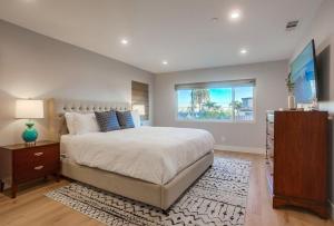 a bedroom with a large bed and a window at North Shore in San Diego