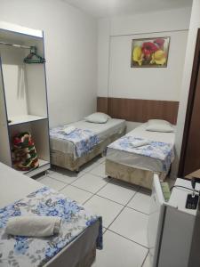 Een bed of bedden in een kamer bij HOTEL DIVINO PAI ETERNO 2