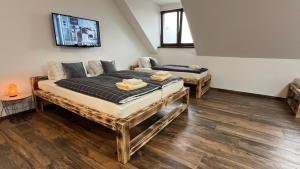 Postel nebo postele na pokoji v ubytování Apartmán KUGA