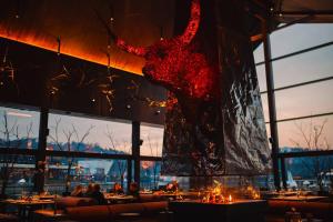 a large red dress hanging in a restaurant at Emily Resort in Lviv