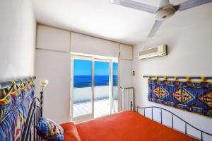 Ένα ή περισσότερα κρεβάτια σε δωμάτιο στο AMORE RENTALS - Villa Terri