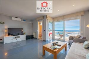 a living room with a view of the ocean at Sol i Aire Apartament Palamós in Palamós