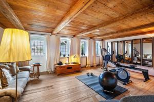 a living room with a couch and a gym at Windhäusern5 in Wangen im Allgäu