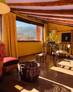 a living room with a view of the desert at Casa de Santiago in Albarracín