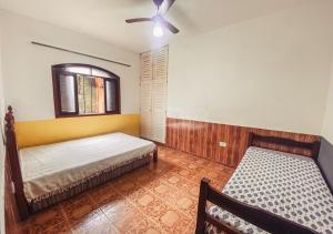 Casa com 3 quartos a 400 metros da Praia tesisinde bir odada yatak veya yataklar