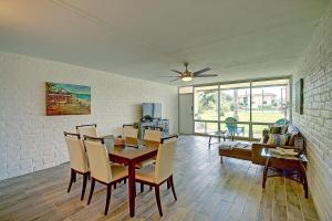 a living room with a dining room table and chairs at A Salty Day Getaway at Sea Sands Condominiums in Port Aransas