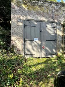 Vonkajšia záhrada v ubytovaní LA CABANE NORMANDE APPARTEMENT 2 à 4 pers
