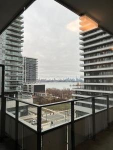 a view from the balcony of an apartment building at Luxury Lakefront Condo in Toronto
