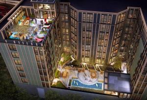 an overhead view of a building with a swimming pool at Downtown Ann Arbor 2 King Bed Balcony Apartment in Ann Arbor
