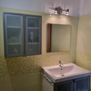 a bathroom with a sink and a mirror at Casa Vacanze AL TEATRO in Diano Castello