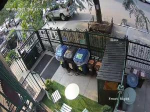 an aerial view of two parking meters next to a fence at Booking.Com Exxlusive: Fully Furnished One Bedroom Entire Apartment With Full Size Bed. For One Person Or Couple, Soulmate Positive Friendship in Brooklyn