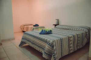 two beds in a room with two beds sidx sidx sidx at Casa Amplia 5 personas con Jardin y Parrilla in Tigre