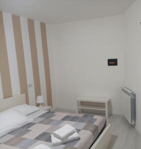 Postel nebo postele na pokoji v ubytování Dalle Zie B&B