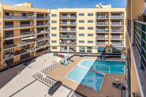 an overhead view of an apartment building with a swimming pool at Mar & Serra ARMACAO DE PERA in Armação de Pêra