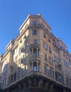 a tall building with balconies on the side of it at Noliday Savona Center Art Deco Apartment in Savona