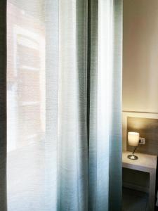 A bed or beds in a room at EASYROOMS ONE