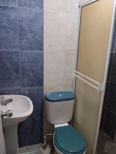 a bathroom with a toilet and a sink at Del Castillo Mirador Hostel in Cartagena de Indias