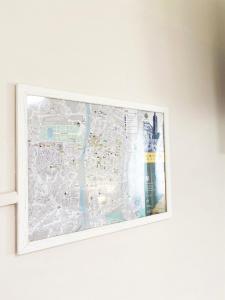 a map on a wall in a white frame at EASYROOMS ONE in Parma