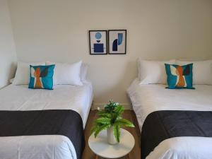 Letto o letti in una camera di APPART-HOTEL L'UNI