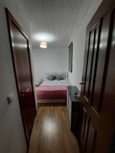 A bed or beds in a room at Casa Vale do Rio