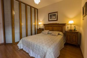 Llit o llits en una habitació de Gracia Suites - Centro y Confort con Parking Gratis