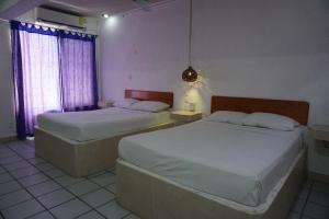 Hostelito Hotel客房内的一张或多张床位