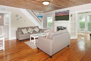 a living room with a couch and a table at Modern 3BR, Pet-Friendly, WiFi, Washer & Dryer in West Palm Beach