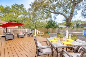 a patio with a table and chairs on a deck at Florida Home Travel NursesandExtended Stays Welcome in St Petersburg