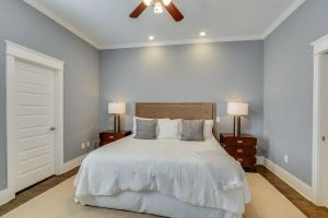 a bedroom with a bed and a ceiling fan at NEW 7 mins to Broadway Sleeps 8 in Nashville