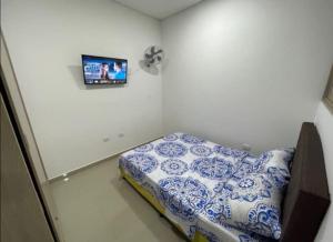 מיטה או מיטות בחדר ב-Apto Villalba