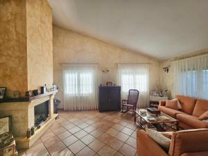a living room with a couch and a fireplace at Mi Limón mi limonero in Valtierra